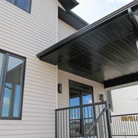 A finished siding job with soffit, cladding and eaves
